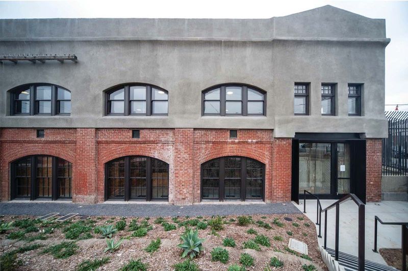 Photo is showing the Front elevation south entrance view of the exterior of the building with brick
