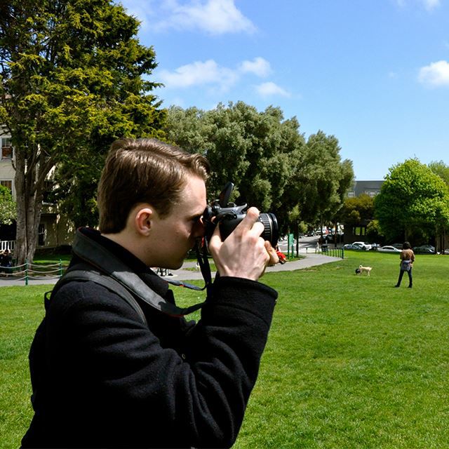 Man outdoors taking a picture