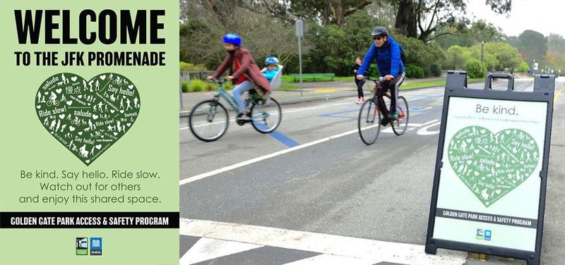 A 'Be Kind, Ride Slow' sign installed along the JFK Promenade