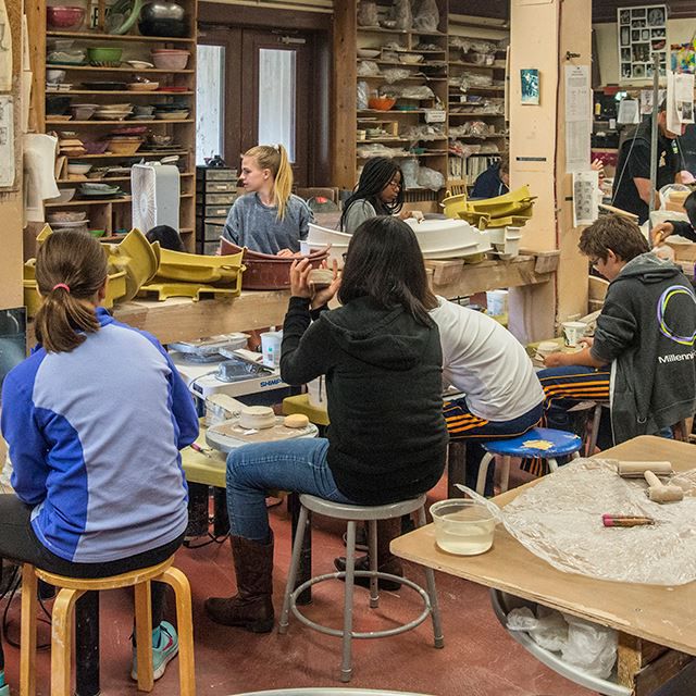 Young people doing pottery
